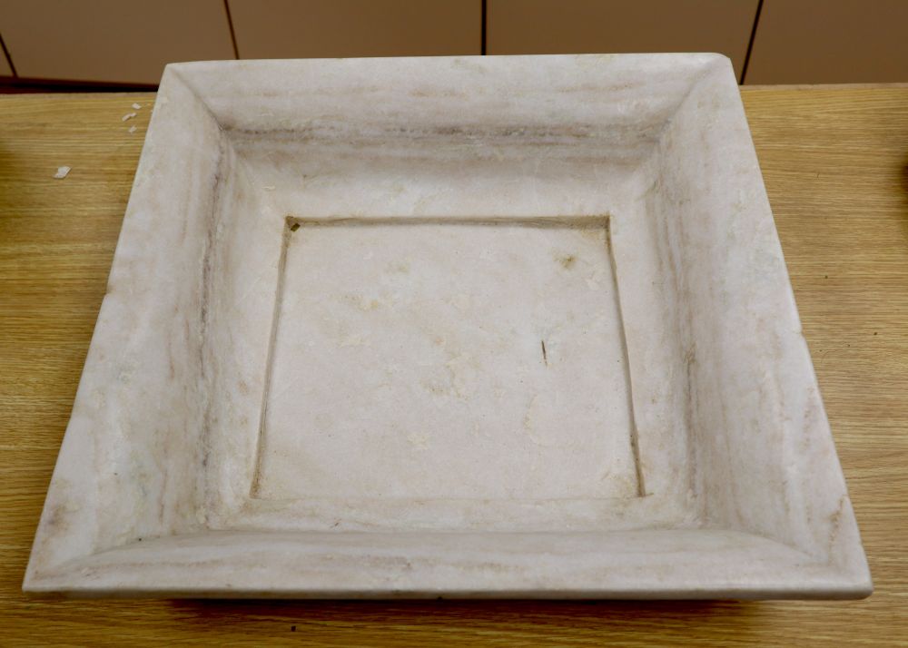 A square marble dish, 51cm sq.